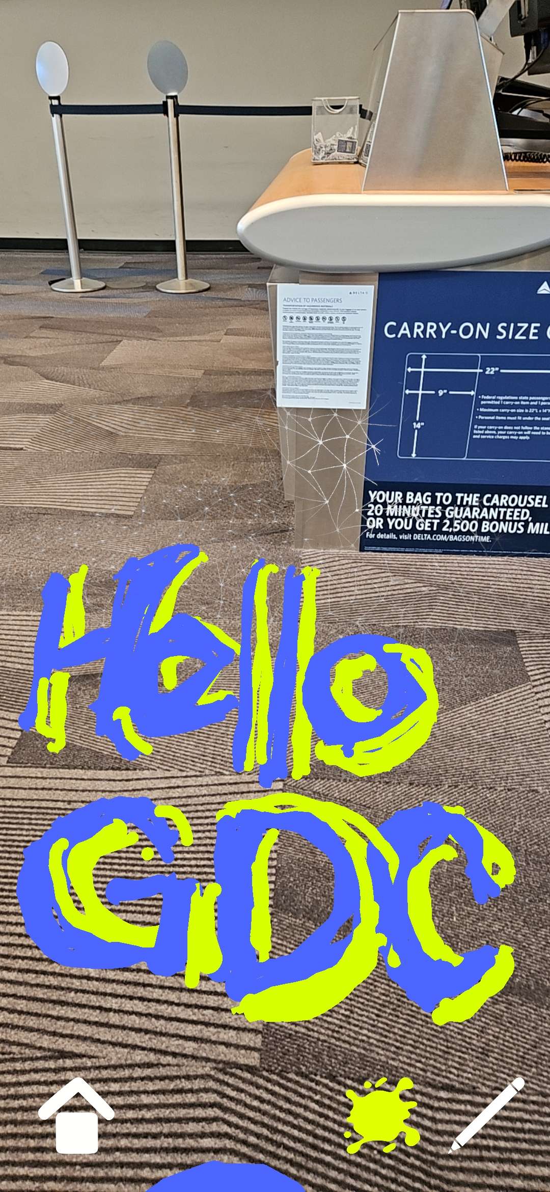 A blue graffiti tag with yellow outlines, it reads: Hello GDC!